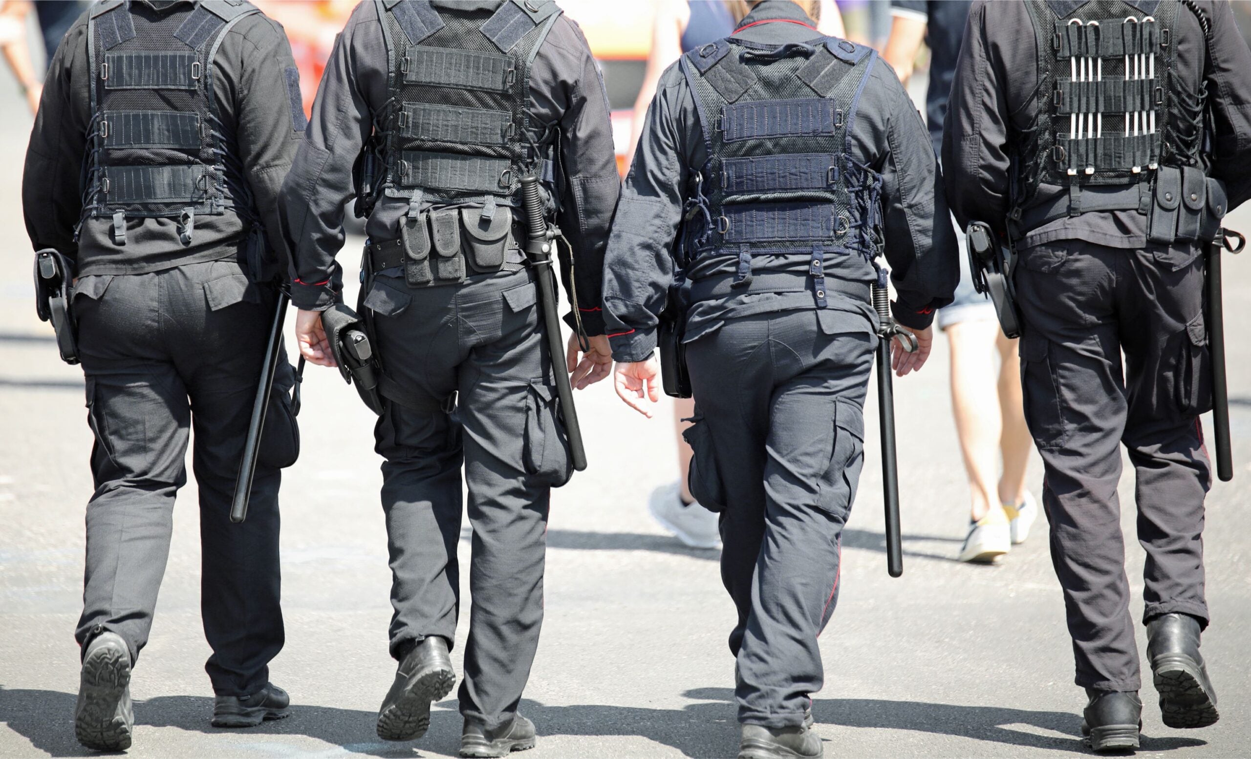 counterterrorism tier tech international sda 4 officers dressed in black walk away from the camera